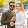 Happy couple spending time together drinking coffee